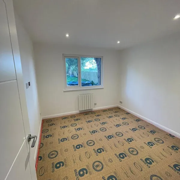 Bedroom freshly decorated, with the underlay down ready for carpet